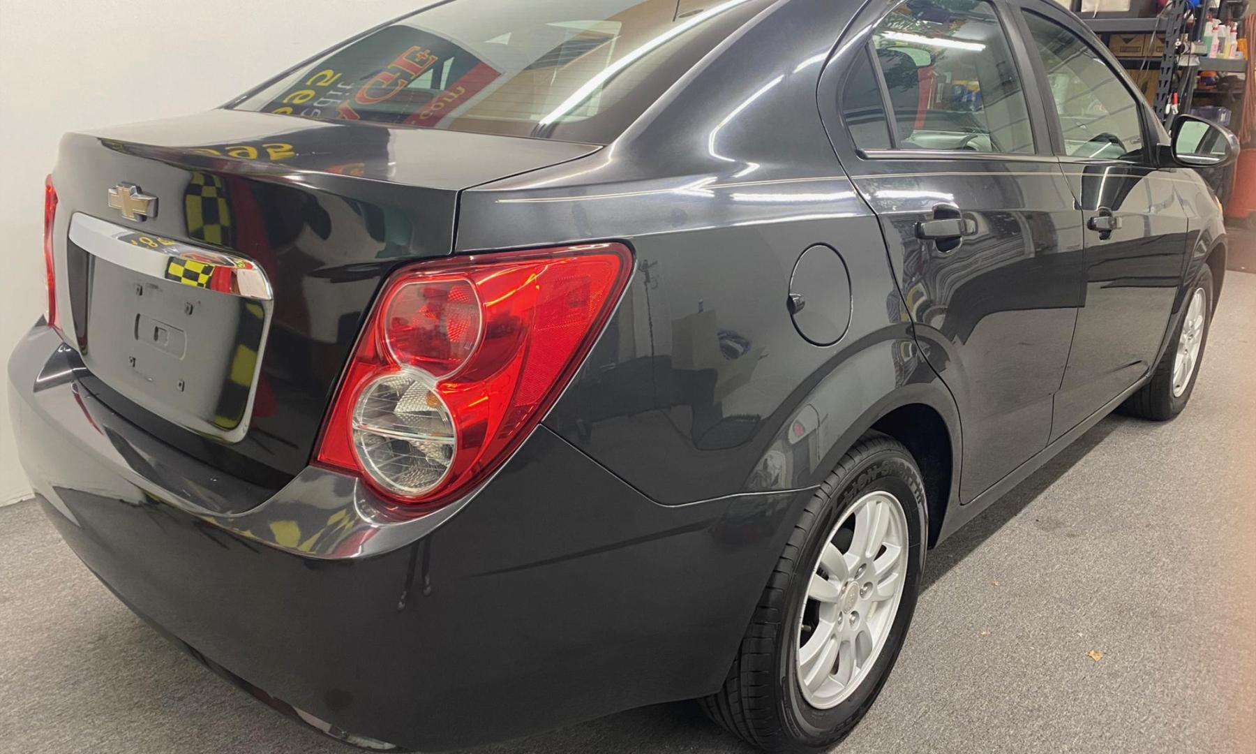 2015 BLACK /BLACK Chevrolet Sonic LT Auto Sedan (1G1JC5SG0F4) with an 1.8L L4 DOHC 24V engine, 6-Speed Automatic transmission, located at 533 S West End Blvd., Quakertown, PA, 18951, (877) 257-4995, 40.343994, -75.303604 - INCLUDED IN THE SALE PRICE OF EVERY VEHICLE: 48 Hour Money Back Guarantee 6 Month - 6,000 Mile Warranty Brand New PA State Inspection & Emission $10 Oil Changes for the Life of the Loan Complete CARFAX - Photo#5